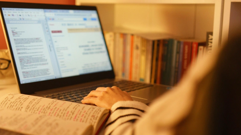 A student working on a laptop